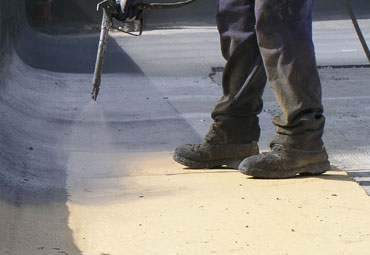 Coating systems over Costa Mesa spray foam roof systems